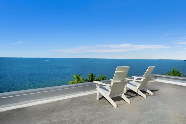 view of patio with a water view