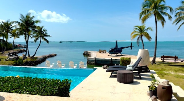 view of pool featuring a water view