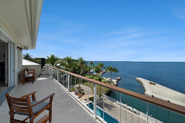 balcony featuring a water view