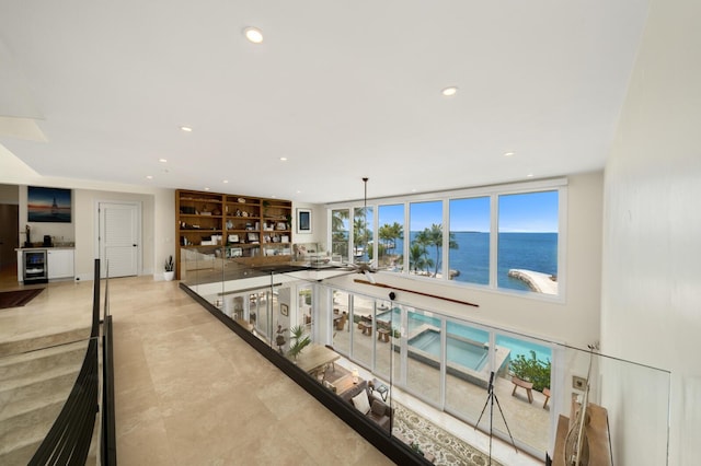 hall featuring wine cooler and a water view