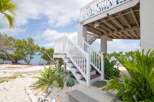 view of property exterior with a water view