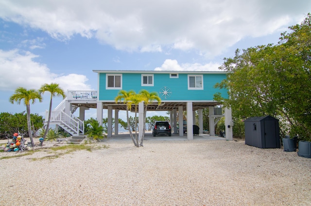 coastal inspired home featuring a carport