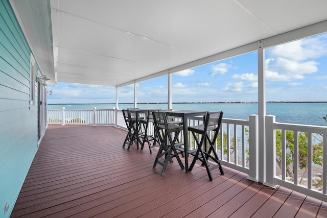 wooden deck with a water view