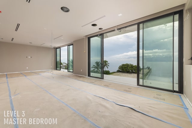 unfurnished room with concrete floors