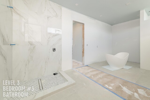 bathroom with tiled shower