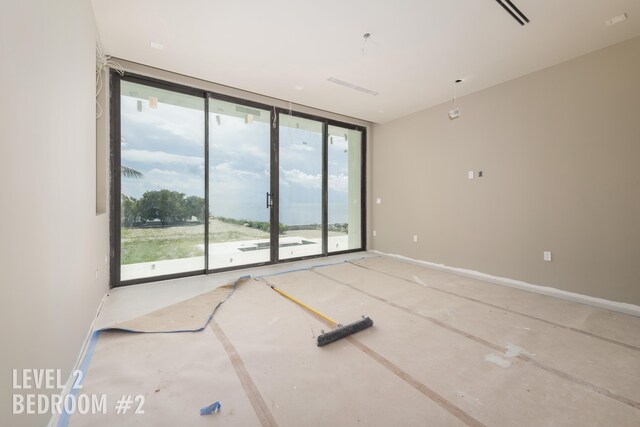 unfurnished living room featuring concrete flooring