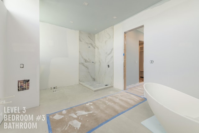 bathroom featuring shower with separate bathtub