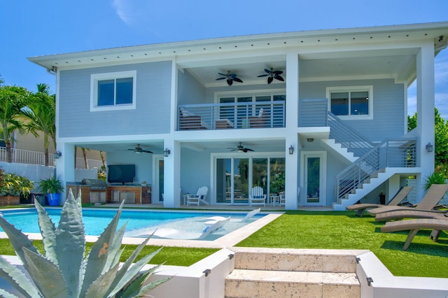 rear view of house featuring a balcony, stairs, an outdoor kitchen, and a ceiling fan