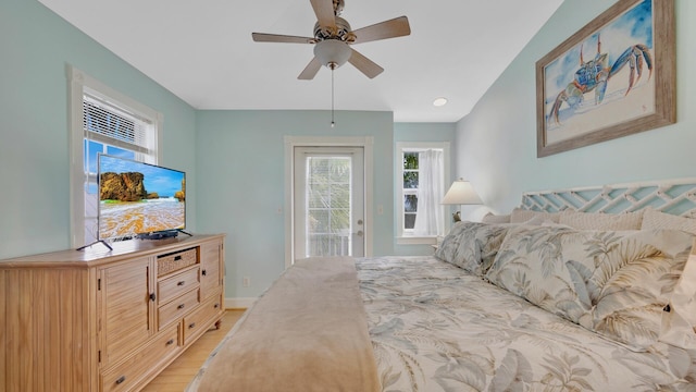 bedroom featuring ceiling fan, access to exterior, and light hardwood / wood-style flooring