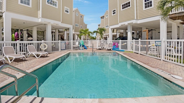 view of pool featuring a patio area