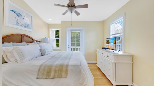 bedroom with ceiling fan, access to outside, and light hardwood / wood-style floors