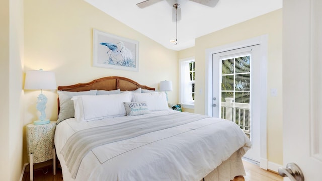 bedroom with lofted ceiling, access to exterior, ceiling fan, and light wood-type flooring