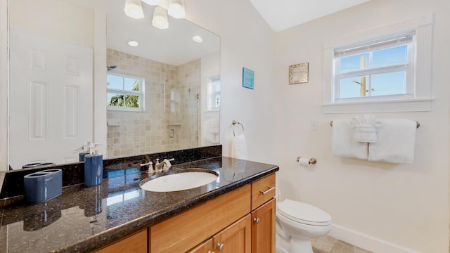 bathroom with vanity, toilet, and an enclosed shower