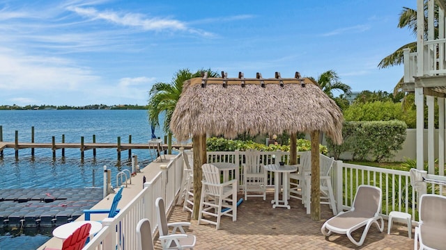 dock area with a gazebo and a water view