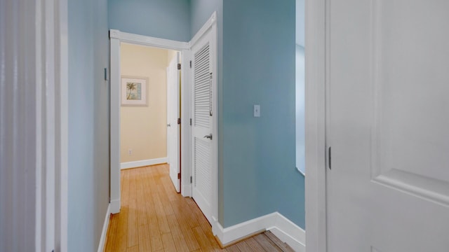 hallway with light hardwood / wood-style flooring