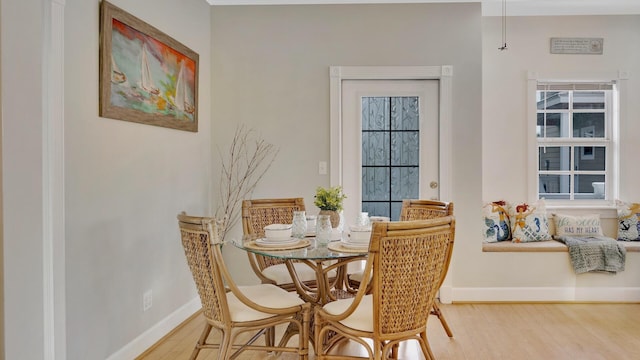 dining area with hardwood / wood-style floors