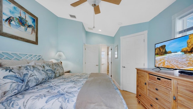 bedroom featuring vaulted ceiling, ceiling fan, and light hardwood / wood-style floors