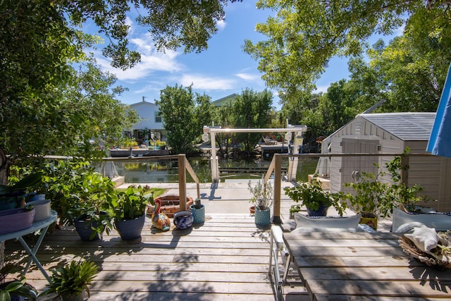 wooden terrace featuring a storage shed