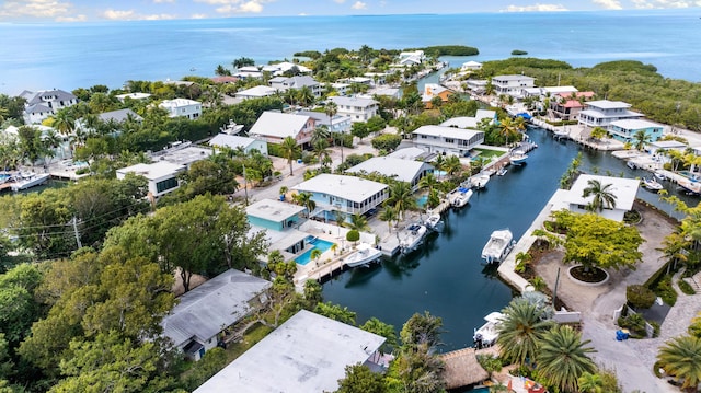 birds eye view of property featuring a residential view and a water view