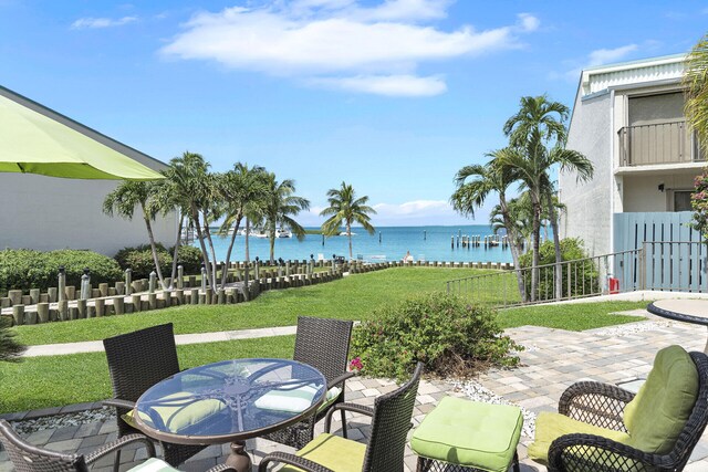 view of patio with a water view