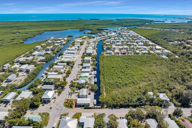 bird's eye view with a residential view and a water view