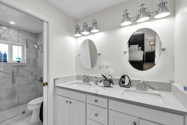 full bath featuring a sink, a marble finish shower, toilet, and marble finish floor