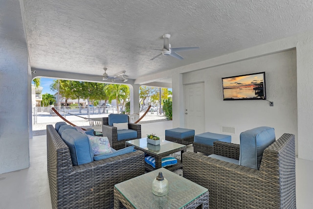 view of patio featuring visible vents, an outdoor hangout area, and a ceiling fan