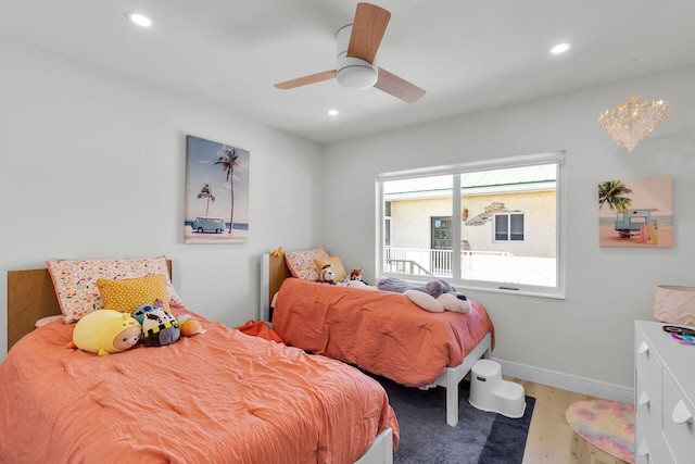 bedroom with recessed lighting, baseboards, wood finished floors, and ceiling fan