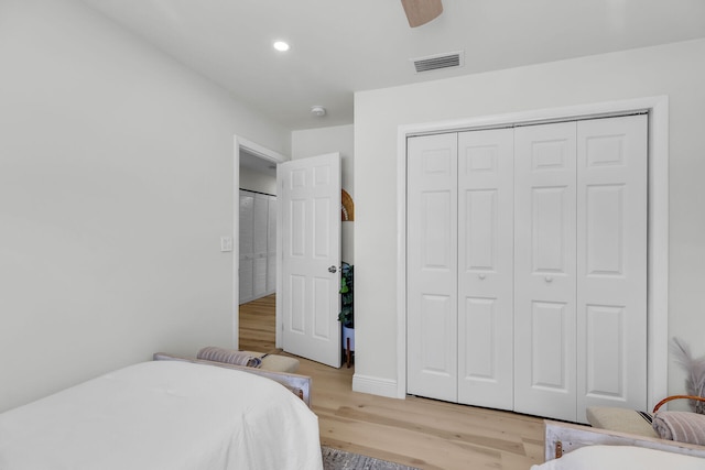 bedroom with visible vents, light wood-style flooring, recessed lighting, a closet, and a ceiling fan