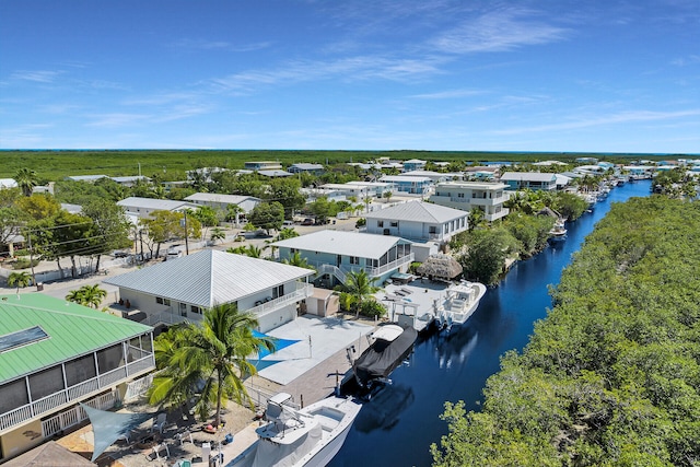 bird's eye view featuring a water view and a residential view