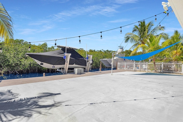 view of street featuring concrete driveway