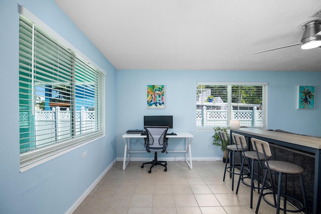 tiled home office with bar area and ceiling fan