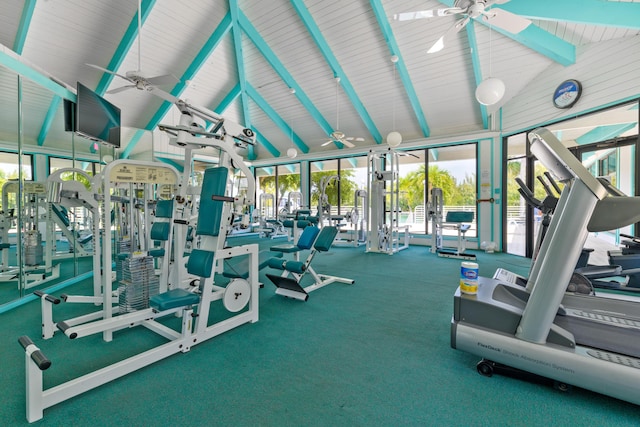 exercise room with high vaulted ceiling and ceiling fan