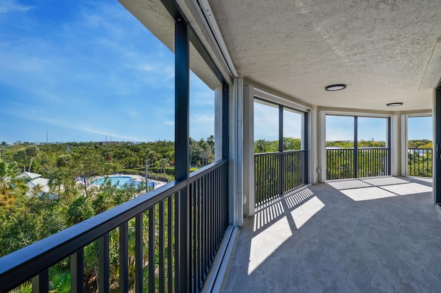 unfurnished sunroom with plenty of natural light