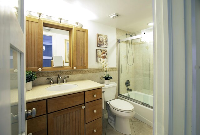 96000 Overseas Hwy Unit X54, Key Largo, FL 33037 - full bath with vanity, toilet, shower / bath combination with glass door, tile patterned floors, and tile walls