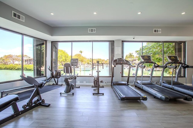 96000 Overseas Hwy Unit X54, Key Largo, FL 33037 - exercise room with wood finished floors, a water view, and recessed lighting