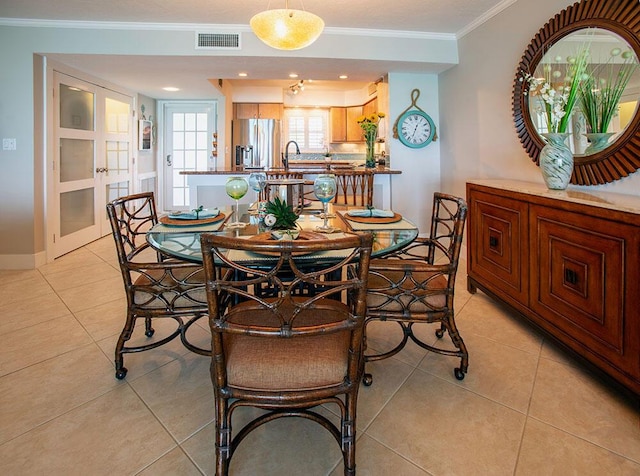 96000 Overseas Hwy Unit X54, Key Largo, FL 33037 - dining area with ornamental molding, light tile patterned floors, and baseboards