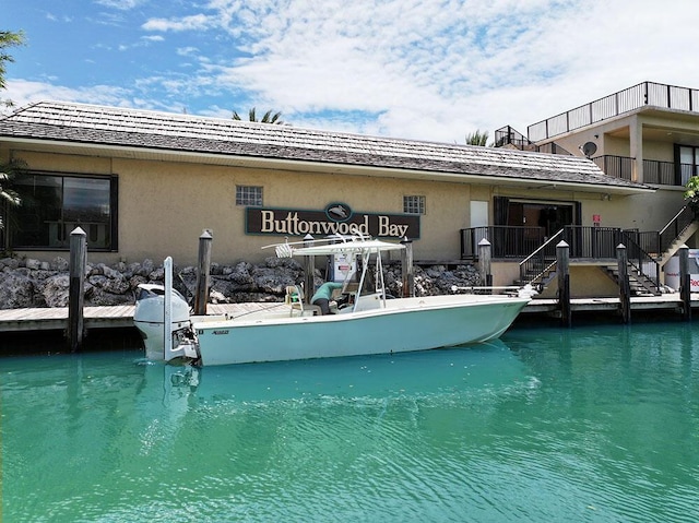96000 Overseas Hwy Unit X54, Key Largo, FL 33037 - back of property with stairs and stucco siding