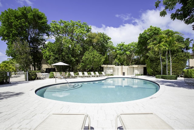96000 Overseas Hwy Unit X54, Key Largo, FL 33037 - community pool with a patio area and view of wooded area