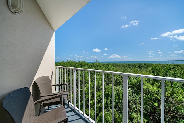 balcony featuring a water view