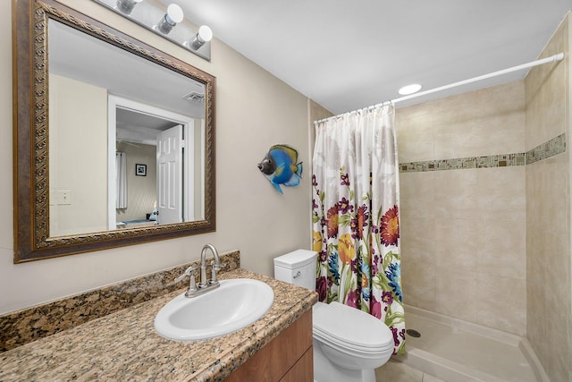 full bathroom featuring visible vents, a shower stall, toilet, and vanity