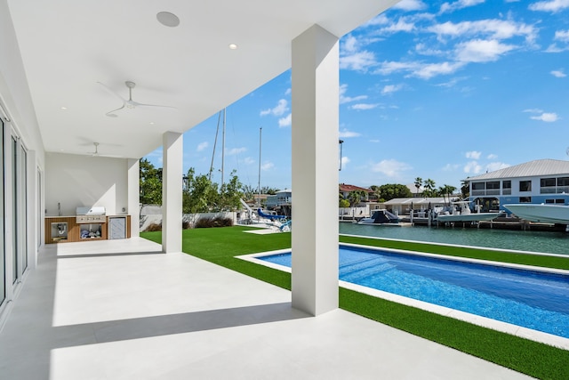 view of swimming pool with a water view, area for grilling, grilling area, ceiling fan, and a patio