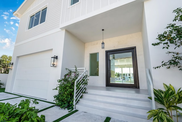 doorway to property featuring a garage