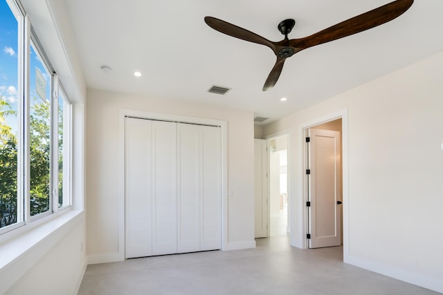 unfurnished bedroom with a closet and ceiling fan