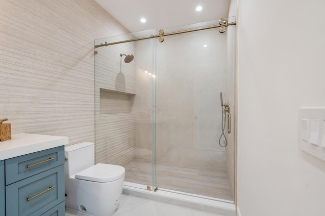 bathroom with toilet, a shower with door, and tile walls