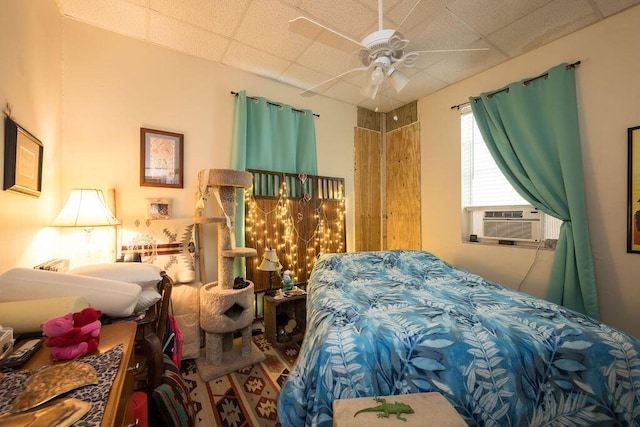 bedroom featuring cooling unit and a drop ceiling