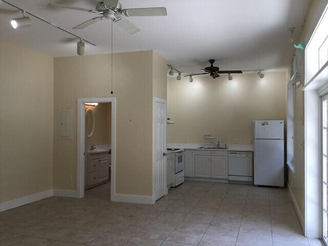 kitchen with ceiling fan, white appliances, track lighting, and sink