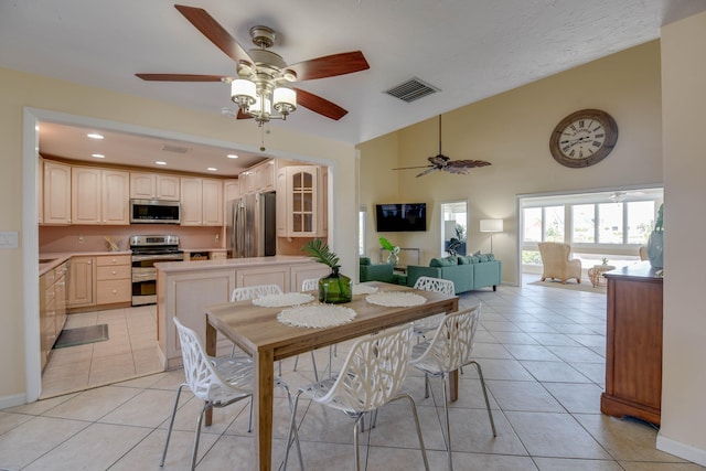 dining area with ceiling fan, visible vents, high vaulted ceiling, recessed lighting, and light tile patterned flooring