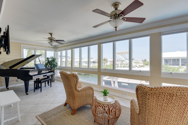 sunroom featuring tile patterned flooring and ornamental molding