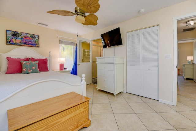 bedroom with a ceiling fan, a closet, light tile patterned flooring, and visible vents